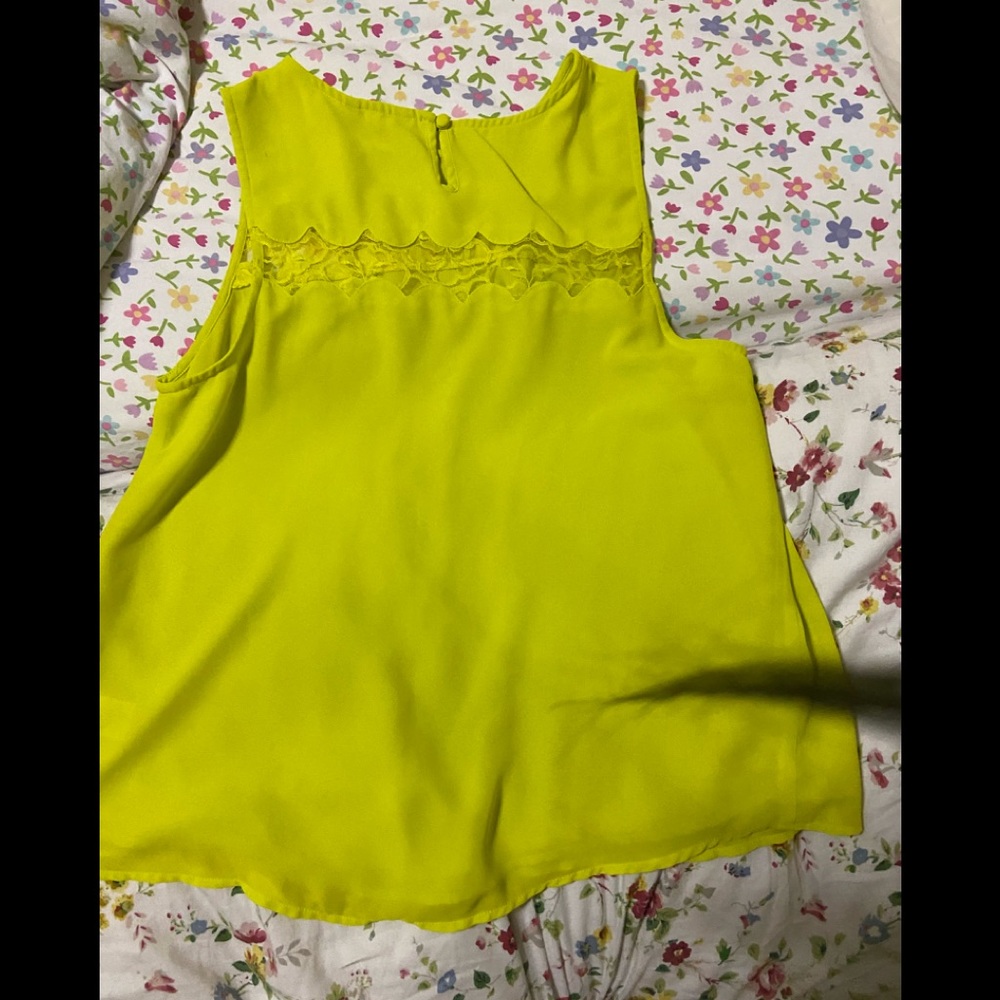 This is a light green shirt by naked zebra size L